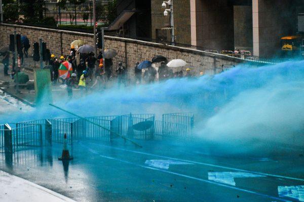 Police fire a water cannon at protesters outside the government headquarters in Hong Kong on Aug. 31, 2019. (Anthony Wallace/AFP/Getty Images)