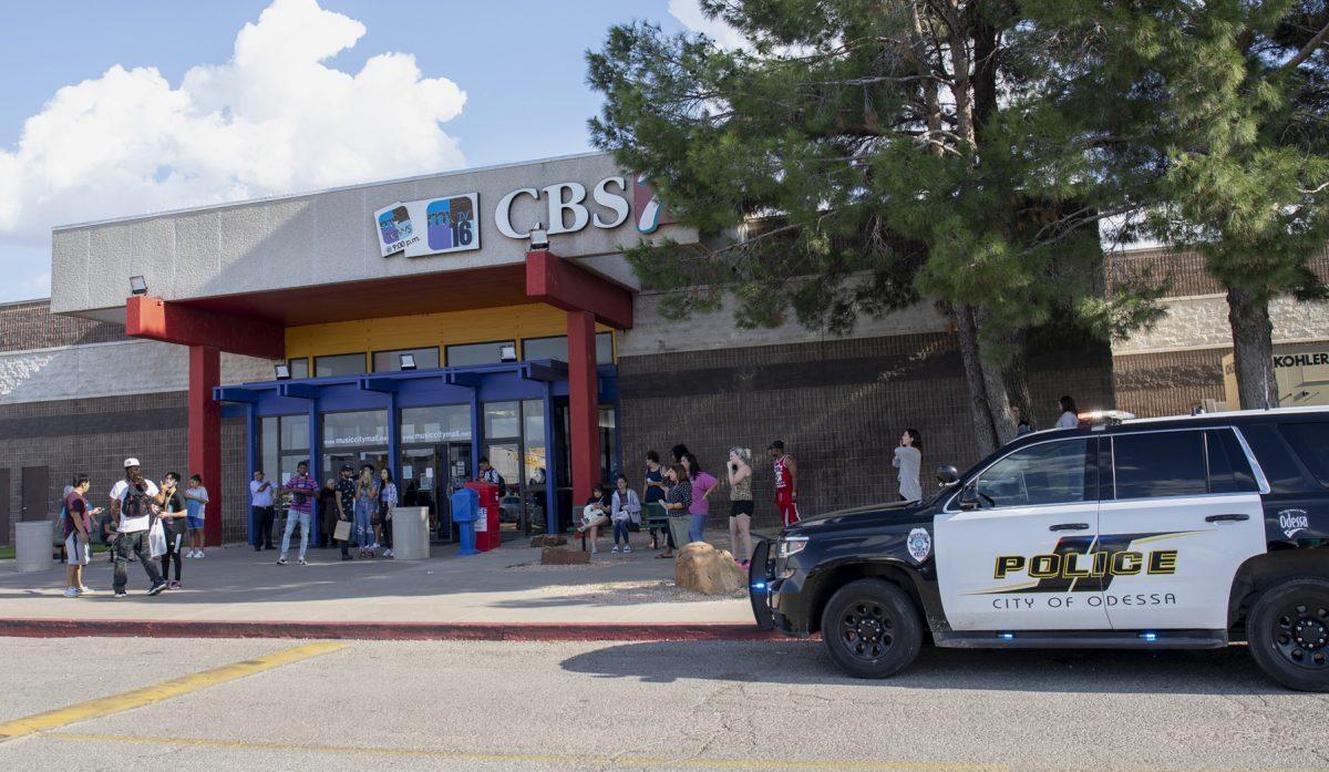 Odessa police officers park their vehicles outside Music City Mall in Odessa, Texas, as they investigate areas following a deadly shooting in the area of Odessa and Midland on Aug. 31, 2019. (Jacy Lewis/Reporter-Telegram via AP)