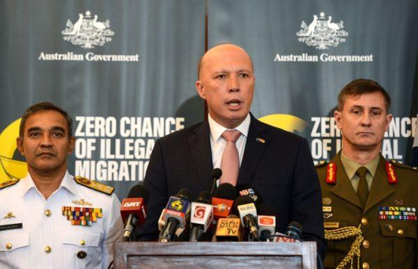 Australia's Home Minister Peter Dutton (C) speaks to the media as Sri Lanka's navy commander Piyal De Silva (L), and the head of Australia's Operation Sovereign Borders Major General Craig Furini (R) look on in Colombo on June 4, 2019. (AFP/Getty Images)