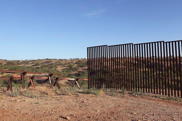 The massive border fence erected by the United States to deter illegal immigration is replaced by a vehicle barrier where it ends near Sasabe, Arizona, on June 1, 2010. (Scott Olson/Getty Images)