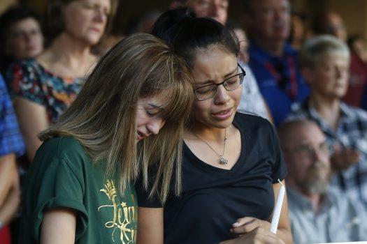 High School students Celeste Lujan, left, and Yasmin Natera mourn their friend Leilah Hernandez, one of the victims of the Saturday shooting in Odessa, at a memorial service in Odessa, Texas, on Sept. 1, 2019. (AP Photo/Sue Ogrocki/AP)