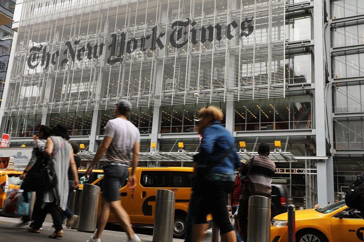 People walk past the New York Times building in New York City on July 27, 2017. (Spencer Platt/Getty Images)
