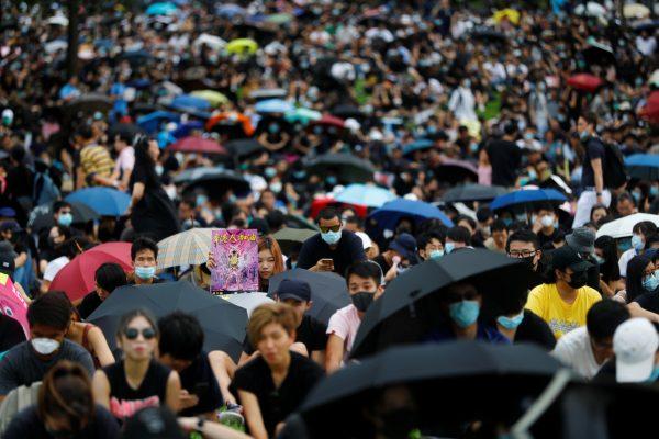 People take part in a general strike at Tamar Park in front of the government buildings in Hong Kong, on Sept. 3, 2019. (Kai Pfaffenbach/Reuters)