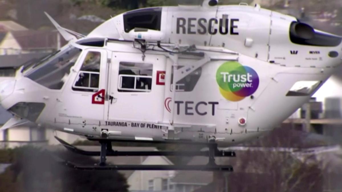 In this image made from video, a helicopter is dispatched to the crash scene in Waikato, New Zealand on Sept. 4. 2019. (TVNZ via AP)