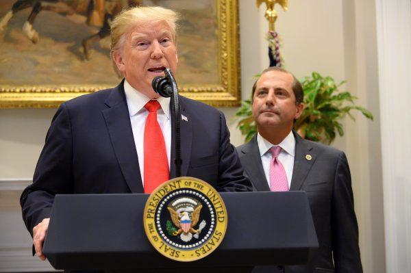 President Donald Trump and Secretary of Health and Human Services Alex Azar (R) gives brief remarks on the administration's actions to combat the opioid crisis and announced $1.8 billion in grants to states and cities to assist in their responses to this crisis during an event at the White House on Sept. 4, 2019. (JIM WATSON/AFP/Getty Images)