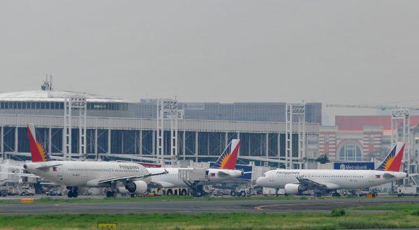 Planes are parked at the Ninoy Aquino International Airport on Aug. 5, 2010. (Noel Celis/AFP/Getty Images)