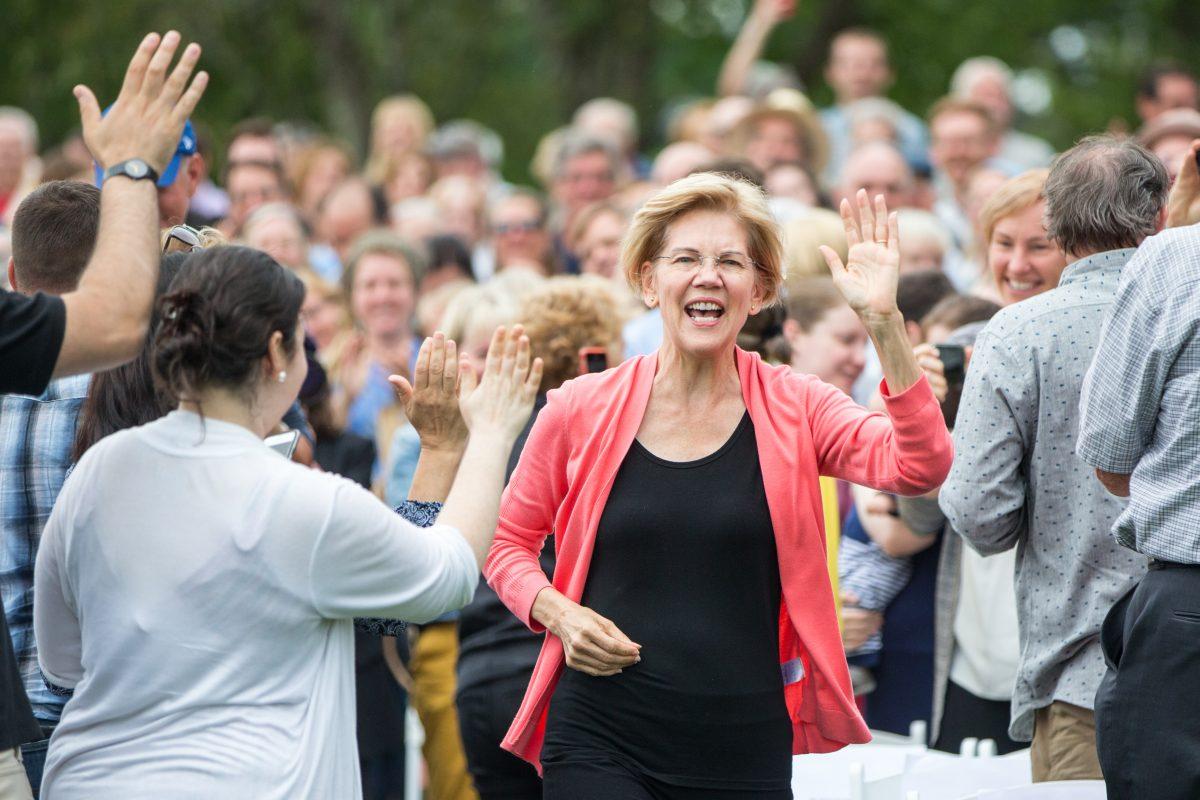 Democratic presidential candidate Sen. Elizabeth Warren (D-Mass.) waves as she arrives to speak during a Labor Day house party in Hampton Falls, New Hampshire on Sept. 2, 2019. (Photo by Scott Eisen/Getty Images)