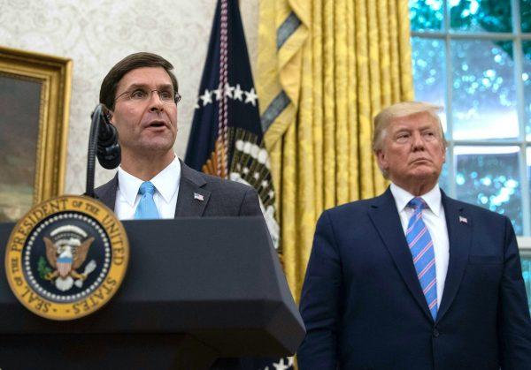 U.S. Defense Secretary Mark Esper speaks after he was sworn in as President Donald Trump looks on in the Oval Office at the White House in Washington on July 23, 2019. (Nicholas Kamm/AFP/Getty Images)
