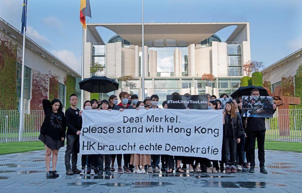 Protesters hold a banner reading "Dear Merkel—please stand with Hong Kong—HK needs real democracy" as they hold a vigil in front of the Chancellery in Berlin on Sept. 5, 2019. The activists demonstrated for the observance of human rights in Hong Kong in front of the Chancellery as German Chancellor Angela Merkel started a trip to China. (Paul Zinken/AFP/Getty Images)