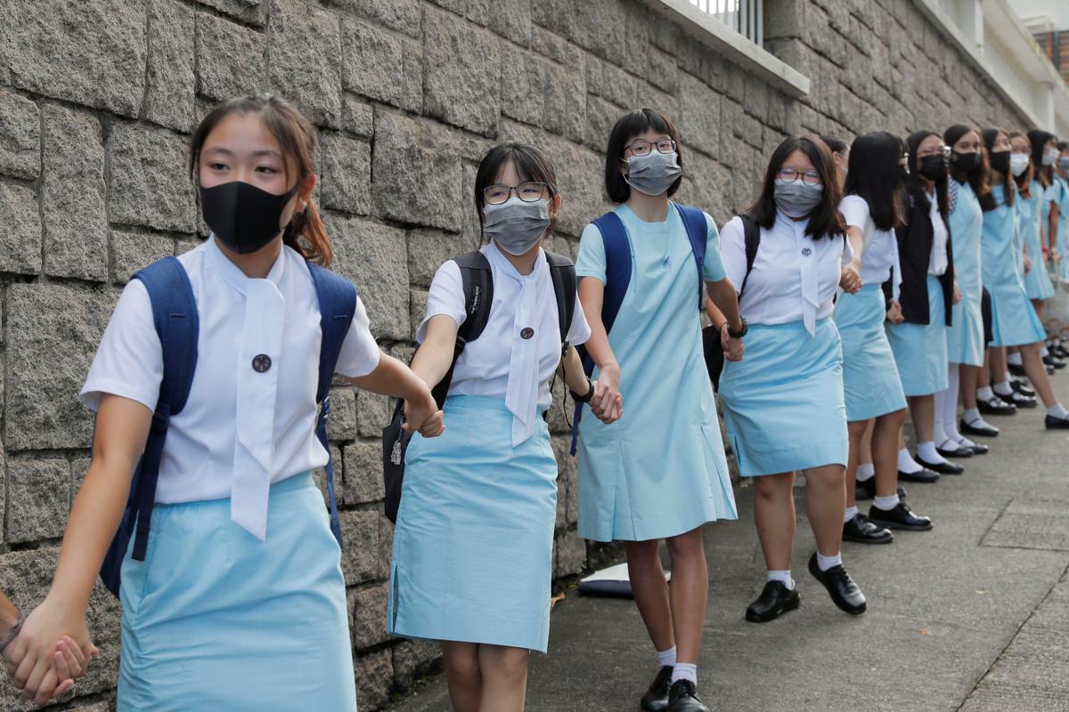 Students form human chain outside the Maryknoll Convent School in Hong Kong on Sept. 6, 2019. (Kin Cheung/AP)