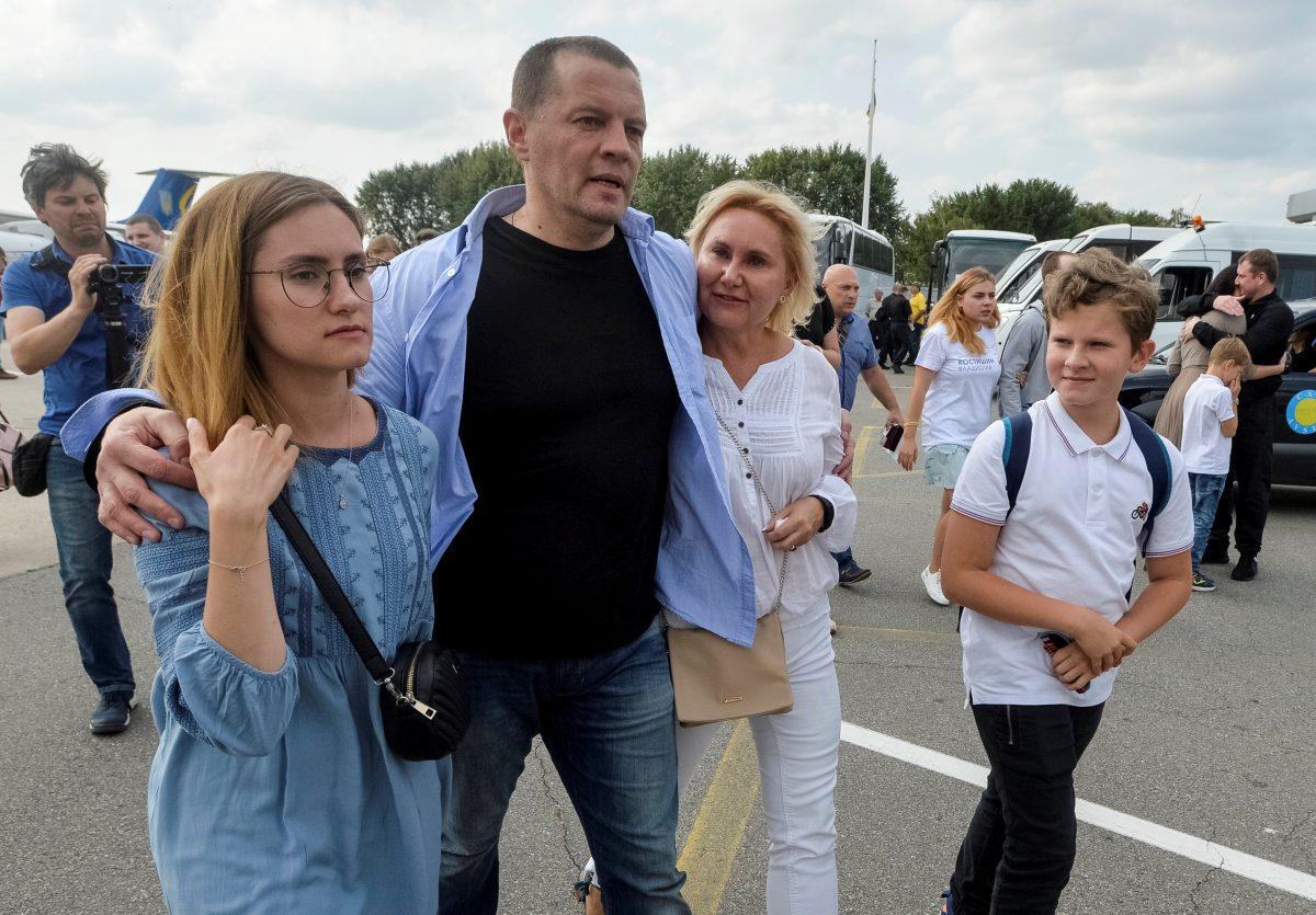 Roman Sushchenko, who was jailed in Russia, is greeted by his relatives upon arrival in Kyiv after Russia–Ukraine prisoner swap, at Borispil International Airport, outside Kyiv, Ukraine, on Sept. 7, 2019. (Oleksandr Klymenko/Reuters)