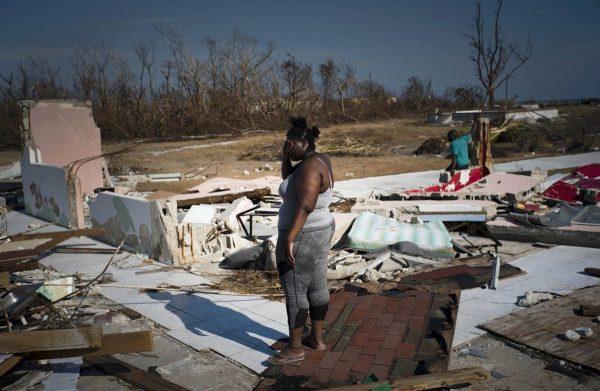 A woman is overcome as she looks at her house destroyed by Hurricane Dorian, in High Rock, Grand Bahama, Bahamas, on Sept. 6, 2019. (Ramon Espinosa/AP Photo)