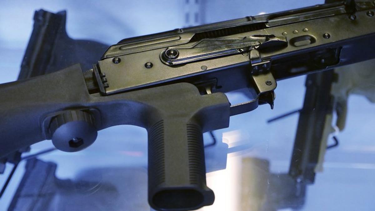 A bump stock is attached to a semi-automatic rifle at the Gun Vault store and shooting range in South Jordan, Utah, on Oct. 4, 2017. (Rick Bowmer/File/AP Photo)