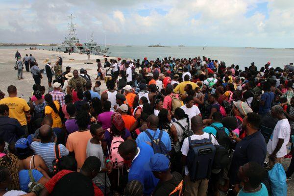 People wait in Marsh Harbor Port to be evacuated to Nassau, in Abaco, Bahamas, on Sept. 6, 2019. (Gonzalo Gaudenzi/AP Photo)