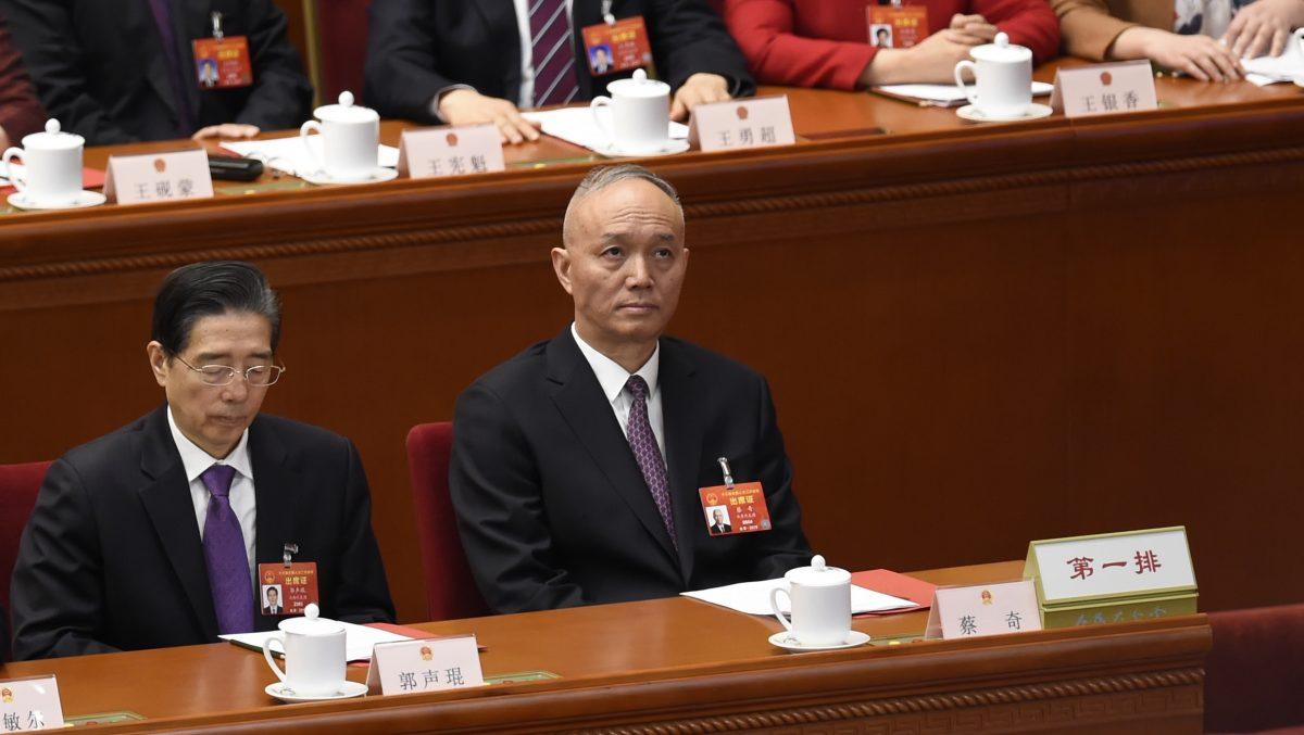 Cai Qi (right) attends the closing session of the National People's Congress in Beijing's Great Hall of the People on March 15, 2019. (Wang Zhao/AFP/Getty Images)