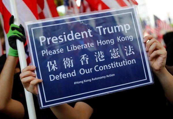 A protester holds a sign during a protest in Central, Hong Kong, China, on Sept. 8, 2019. (REUTERS/Kai Pfaffenbach)