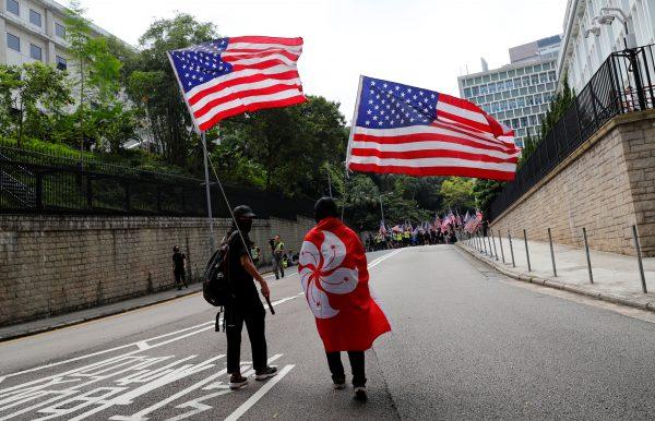 Protesters hold U.S. flags during a march to the U.S. Consulate General in Hong Kong, China, on Sept. 8, 2019. (REUTERS/Anushree Fadnavis)