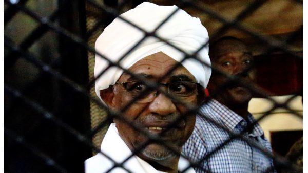 Sudan's former president Omar Hassan al-Bashir smiles as he is seen inside a cage at the courthouse where he is facing corruption charges, in Khartoum, Sudan on Aug. 31, 2019. (Mohamed Nureldin Abdallah/Reuters)