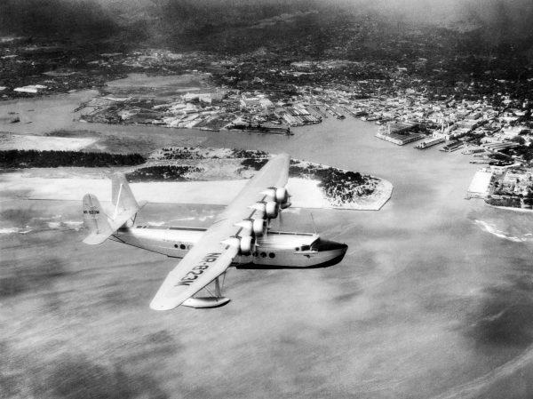 The SIKORSKY S-42 Pan American Clipper flies over Pearl Harbor, Hawaii, on July 19, 1935, on the return flight of the second trip between California and the Islands. (AFP/Getty Images)