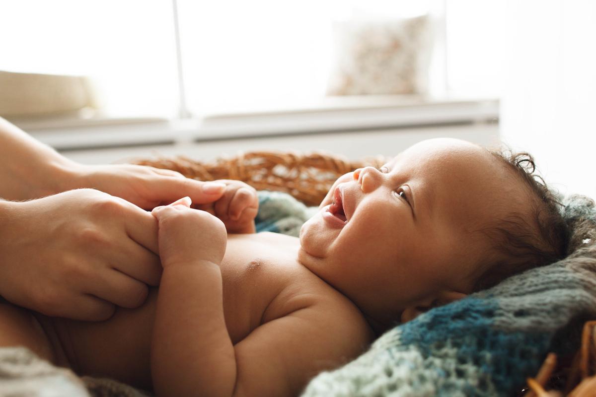 Illustration - Shutterstock | <a href="https://www.shutterstock.com/image-photo/baby-smiling-mother-closeup-adorable-newborn-519260152?src=-1-0">Golubovy</a>