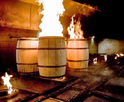 Charring oak barrels, destined for making bourbon. (Shutterstock)