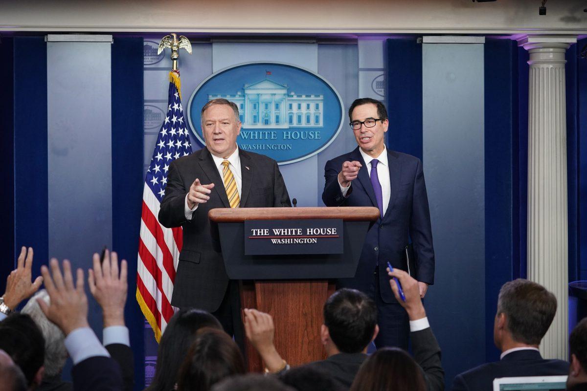 Treasury Secretary Steven Mnuchin, right, and Secretary of State Mike Pompeo brief the media at the White House in Washington on Sept. 10, 2019. Pompeo said reporting about the extraction of a spy was "factually wrong." (Mandel Ngan/AFP/Getty Images)