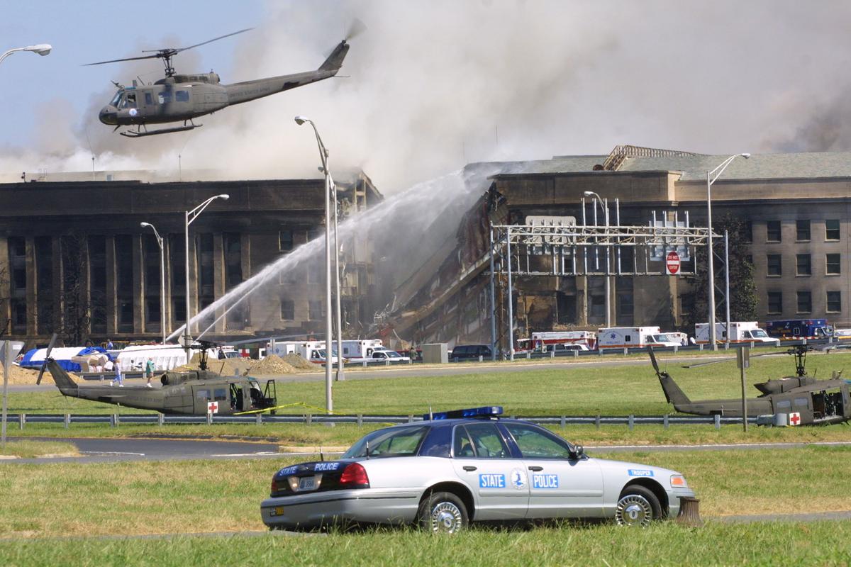 Smoke comes out from the Southwest E-ring of the Pentagon building in Arlington, Virginia on Sept. 11, 2001, after a plane crashed into the building and set off a huge explosion. (Alex Wong/Getty Images)