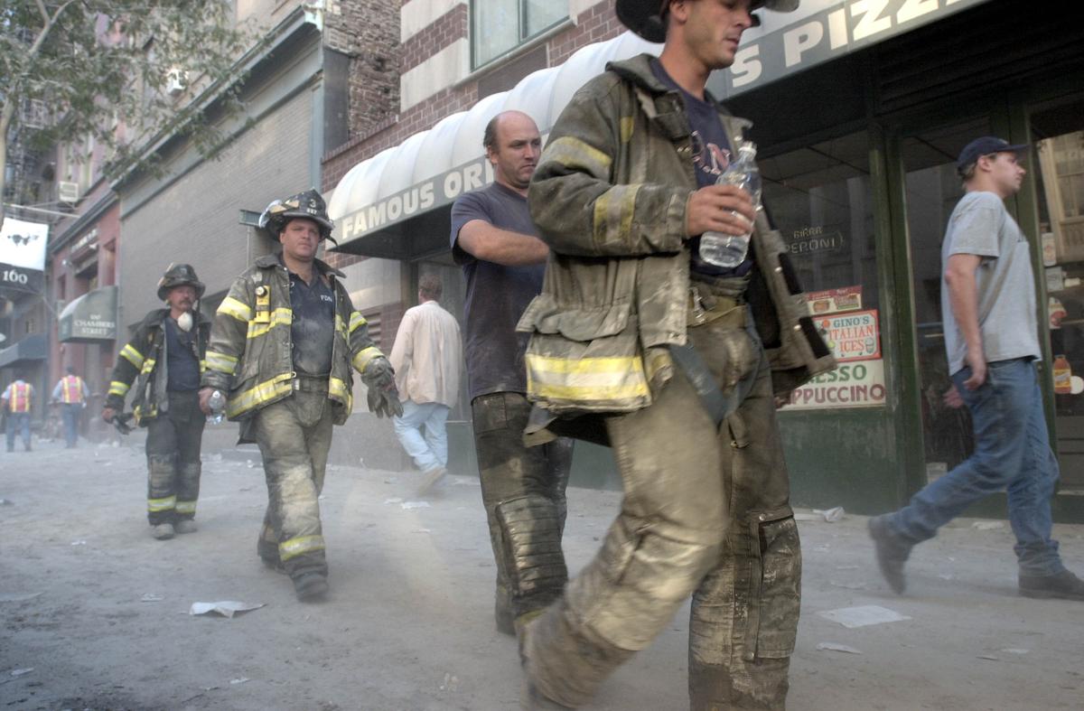 Fireman walk down Chambers Street on Sept. 12, 2001 towards the remains of the World Trade Center in New York City. (Darren McCollester/Getty Images)
