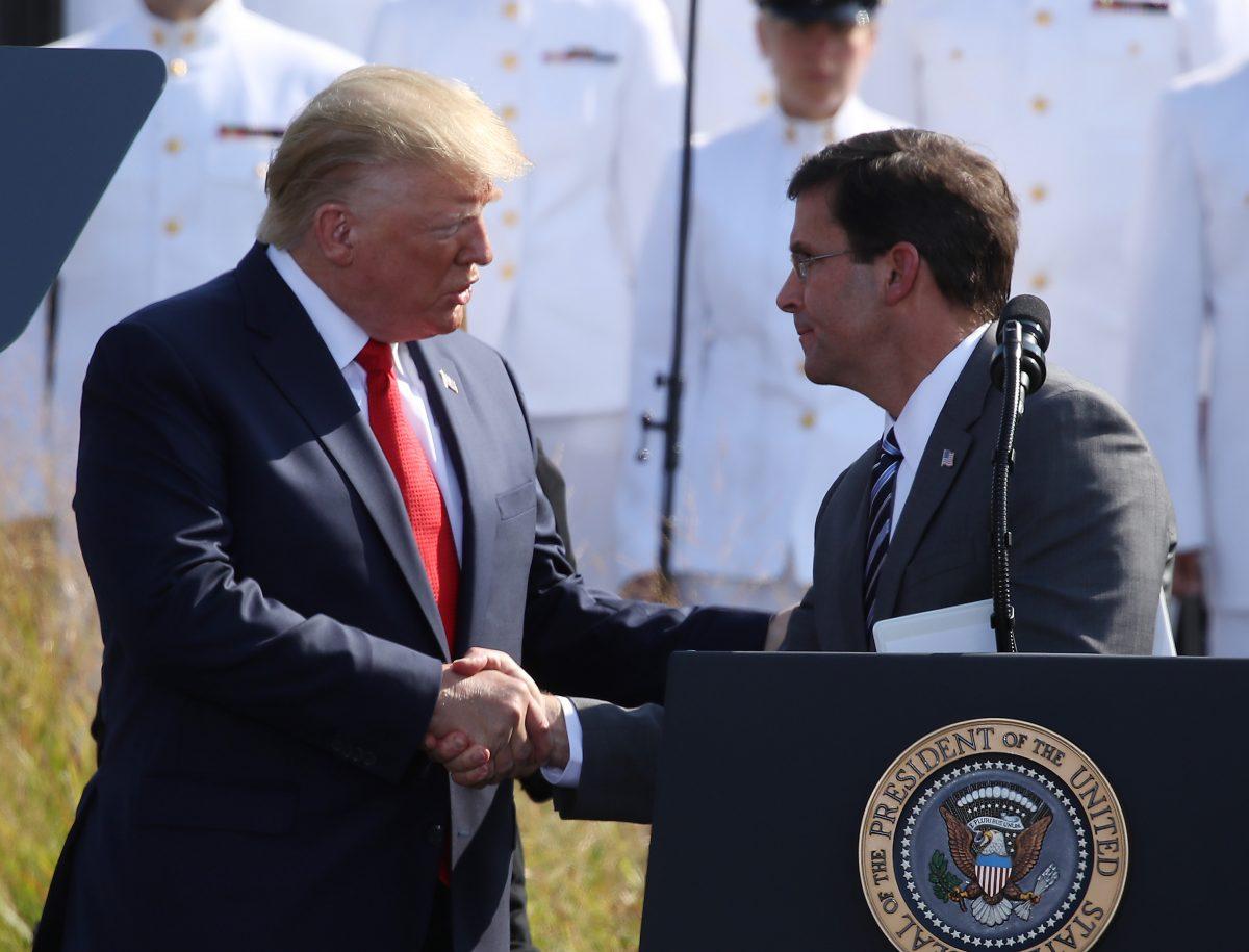 President Donald Trump, left, shakes hands with Secretary of Defense Mark Esper during a 9/11 memorial ceremony on Sept. 11, 2019. (Mark Wilson/Getty Images)