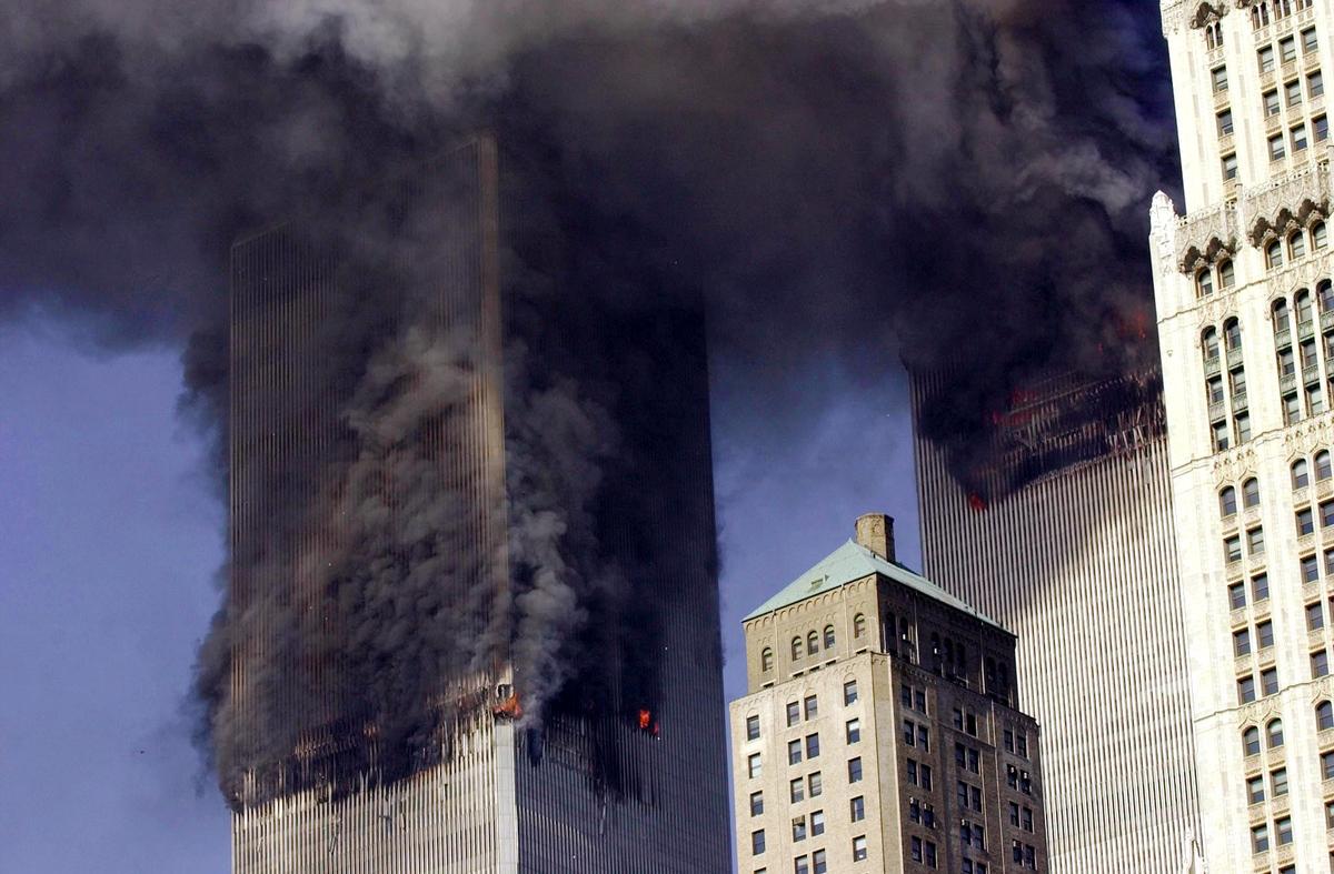 The twin towers of World Trade Center burn after two planes crashed into each building in New York on Sept. 11, 2001. (Stand Honda/AFP/Getty Images)