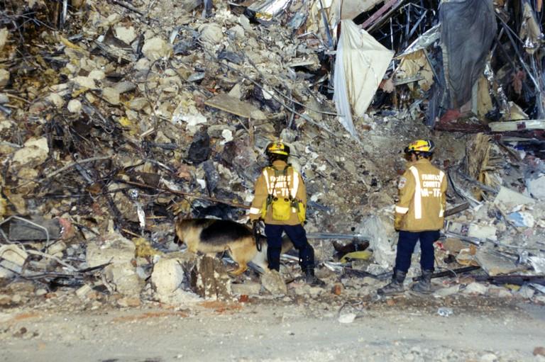Emergency responders survey the damage on scene following an attack at the Pentagon in Arlington, Virginia, on Sept. 11, 2001 in this undated image. American Airlines Flight 77 was hijacked by al Qaeda terrorists who flew it in to the building, killing 184 people. (Federal Bureau of Investigation via Getty Images)