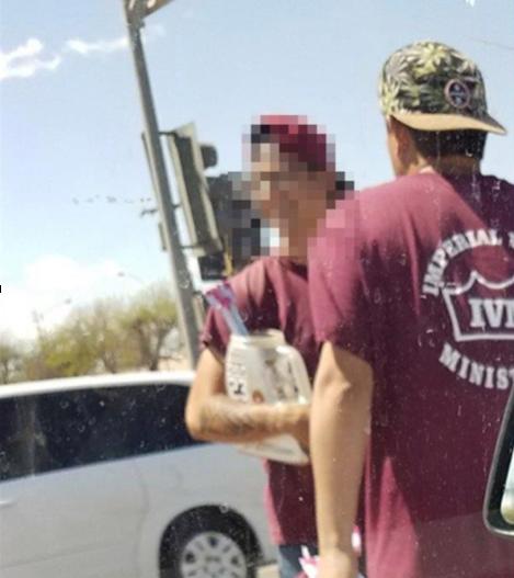 IVM panhandlers in this undated picture included in Department of Justice documents linked to the indictment of a dozen IVM leaders on Aug. 23, 2019. (Department of Justice)
