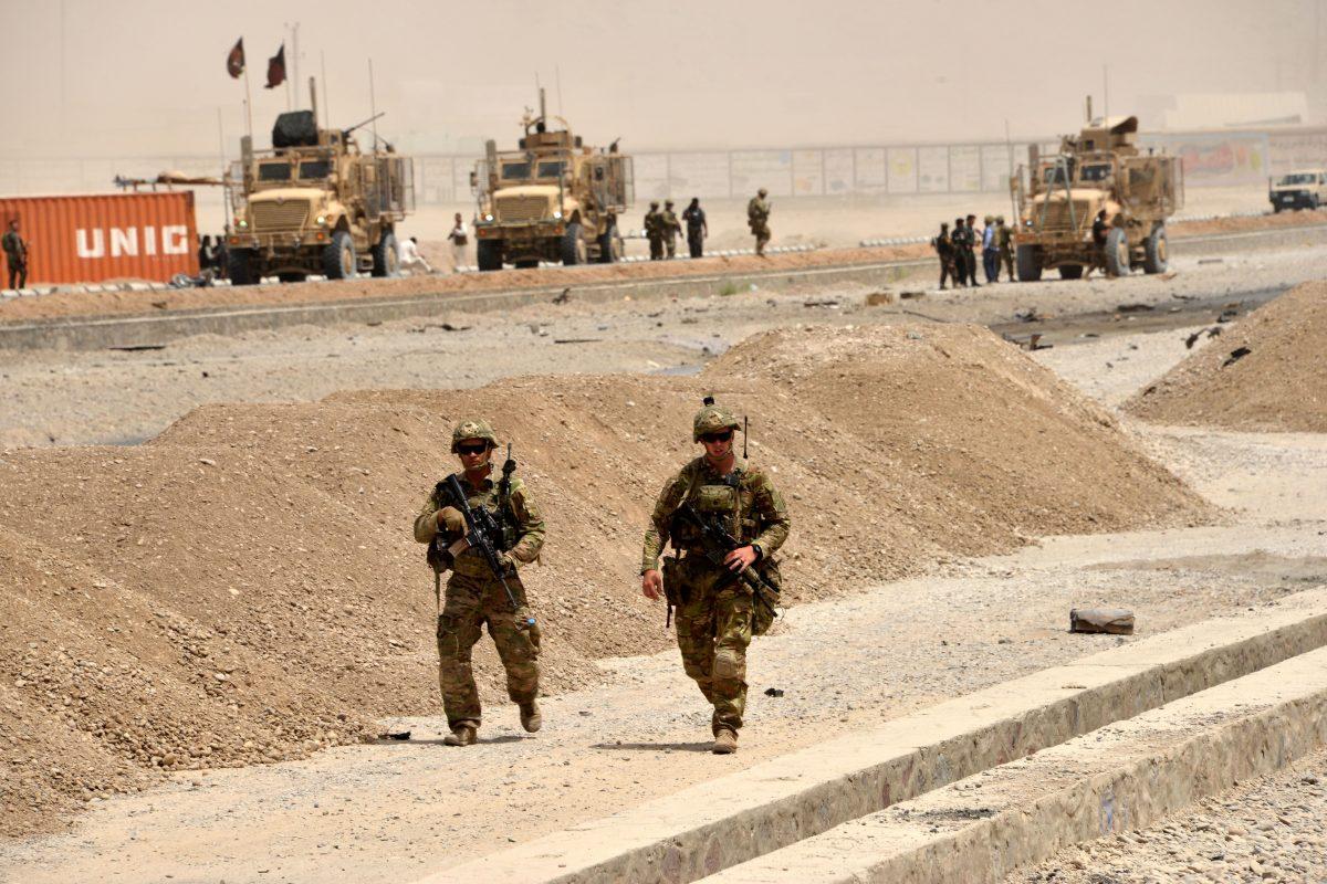 U.S. soldiers walk at the site of a Taliban suicide attack in Kandahar on Aug. 2, 2017. (Javed Tanveer/AFP/Getty Images)