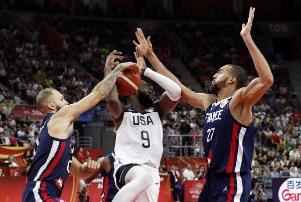 Basketball - FIBA World Cup - Quarter Finals - United States v France - Dongguan Basketball Center, Dongguan, China - Sept. 11, 2019. Jaylen Brown of the U.S. in action with France's Evan Fournier and Rudy Gobert. (Kim Kyung-Hoon/Reuters)