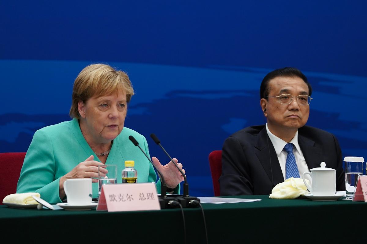 Chancellor of Germany Angela Merkel (L) gives a speech next to Chinese Premier Li Keqiang during the German-Chinese Dialogue Forum at the Great Hall of the People in Beijing on Sept. 6, 2019. (Andrea Verdelli/AFP/Getty Images)