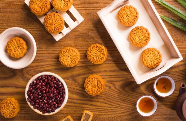 Traditional mooncakes served with tea. (Shutterstock)