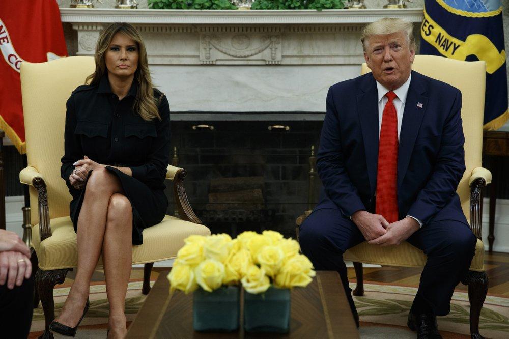 First lady Melania Trump listens as President Donald Trump talks about a plan to ban most flavored e-cigarettes, in the Oval Office of the White House, in Washington, on Sept. 11, 2019. (Evan Vucci/AP Photo)