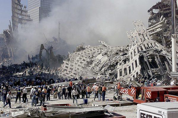 Fire and rescue workers search through the rubble of the World Trade Center in New York on Sept. 13, 2001. Rescue and cleanup continued after the Twin Towers were destroyed on Sept. 11 by terrorists in hijacked commercial aircraft. (Beth A. Keiser/AFP/Getty Images)