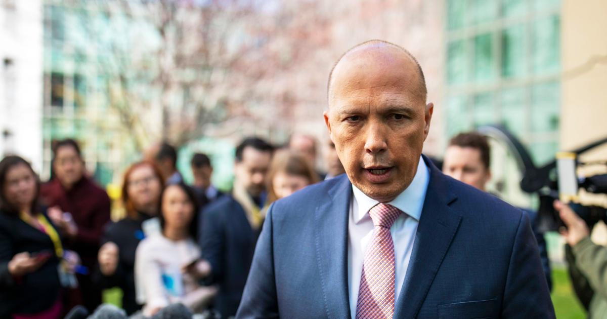 Australian Home Affairs Minister Peter Dutton faces the media at a press conference in Canberra on Aug. 21, 2018. (Sean Davey/AFP/Getty Images)