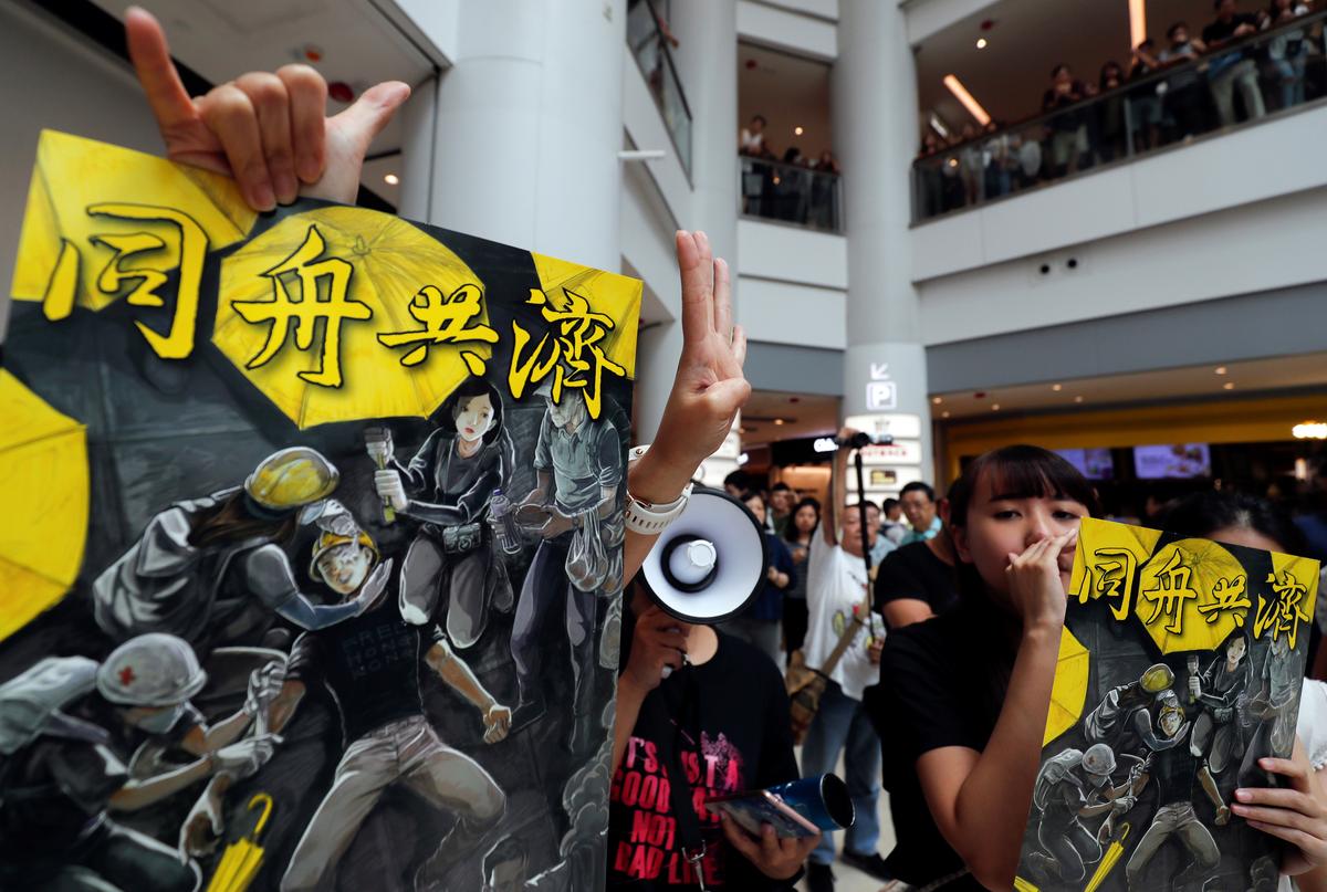 Anti-government protesters hold placards at Olympian City 2 shopping mall in Hong Kong, China on Sept. 13, 2019. (Amr Abdallah Dalsh/Reuters)