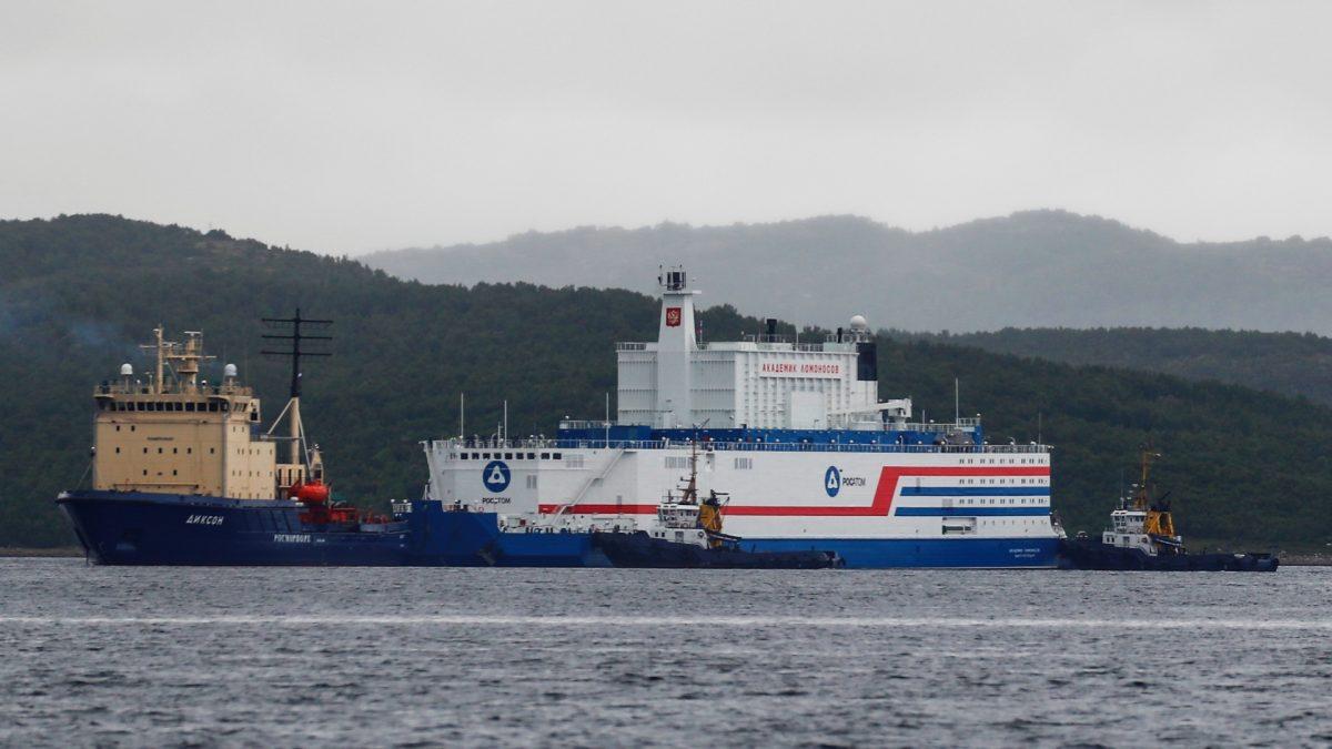 A view shows Russia's floating nuclear power plant Akademik Lomonosov and tugboat Dixon before the departure from the service base of Rosatomflot company for a journey along the Northern Sea Route to Chukotka in Murmansk, Russia, on Aug. 23, 2019. (Maxim Shemetov/Reuters)