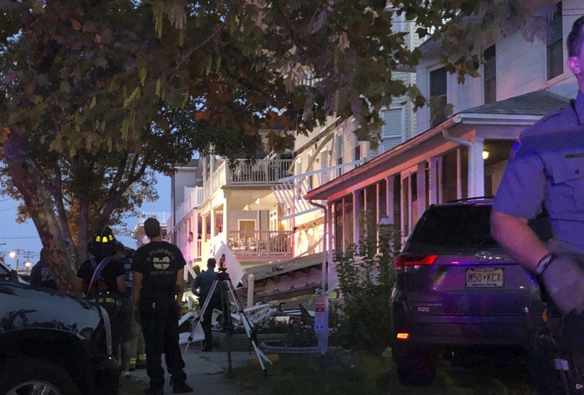 First responders work the scene of a building structure damage in Wildwood, N.J., Saturday, Sept. 14, 2019. Officials say several people were injured when decks collapsed on one another at the three-story residence on the Jersey Shore. (Ahmad Austin/The Press of Atlantic City via AP)/The Press of Atlantic City via AP)