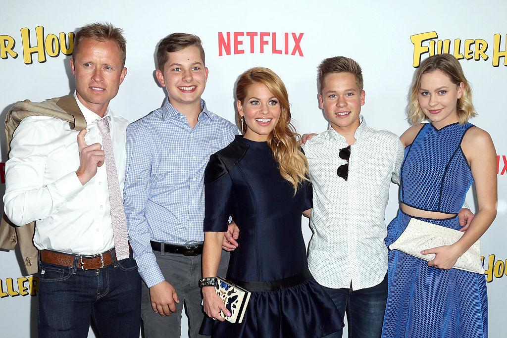 (L-R) Valeri Bure, Lev Valerievich Bure, Candace Cameron-Bure, Maksim Valerievich Bure, and Natasha Valerievna Bure at the premiere of "Fuller House" in LA on Feb. 16, 2016 (©Getty Images | <a href="https://www.gettyimages.com.au/detail/news-photo/professional-hockey-player-valeri-bure-lev-valerievich-bure-news-photo/510751192">Frederick M. Brown</a>)