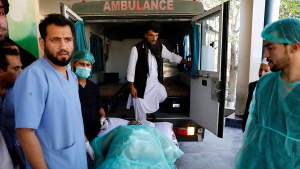 An injured man is transported to an ambulance at a hospital, after a blast in Kabul, Afghanistan on Sept. 17, 2019. (Mohammad Ismail/Reuters)