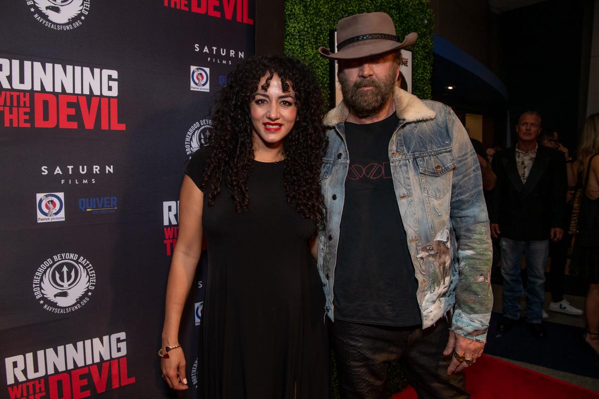 Elia Aboumrad and Nicolas Cage attend the premiere of Quiver Distribution's 'Running with the Devil' at Writers Guild Theater in Beverly Hills, California on Sept. 16, 2019. (Photo by Emma McIntyre/Getty Images)