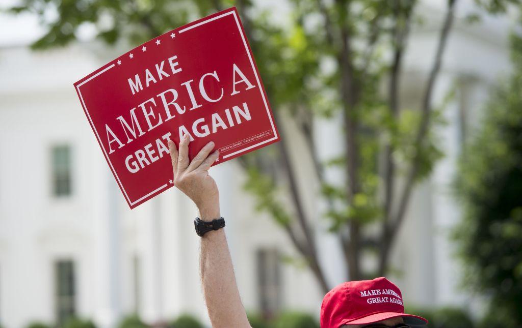 A man holds a Make America Great Again sign during a rally in Lafayette Square next to the White House in Washington on June 3, 2017. (Saul Loeb/AFP/Getty Images)