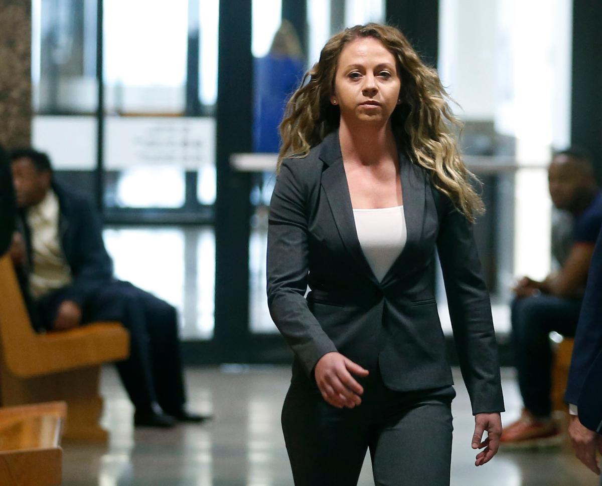 Former Dallas Police officer Amber Guyger walks the hallway on her third court appearance at the Frank Crowley Courts Building in Dallas, on March 18, 2019. (Vernon Bryant/The Dallas Morning News via AP, File)