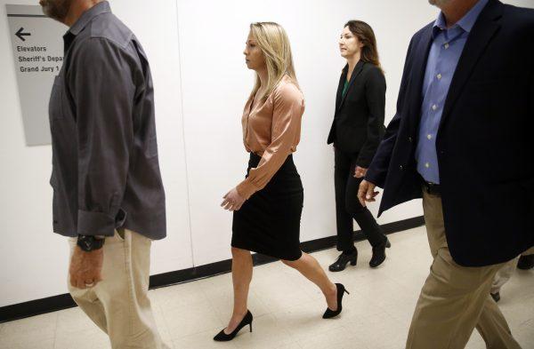 Fired Dallas police Officer Amber Guyger (center) arrives for jury selection in her murder trial at the Frank Crowley Courthouse in downtown Dallas on Sept. 13, 2019. (Tom Fox/The Dallas Morning News via AP)
