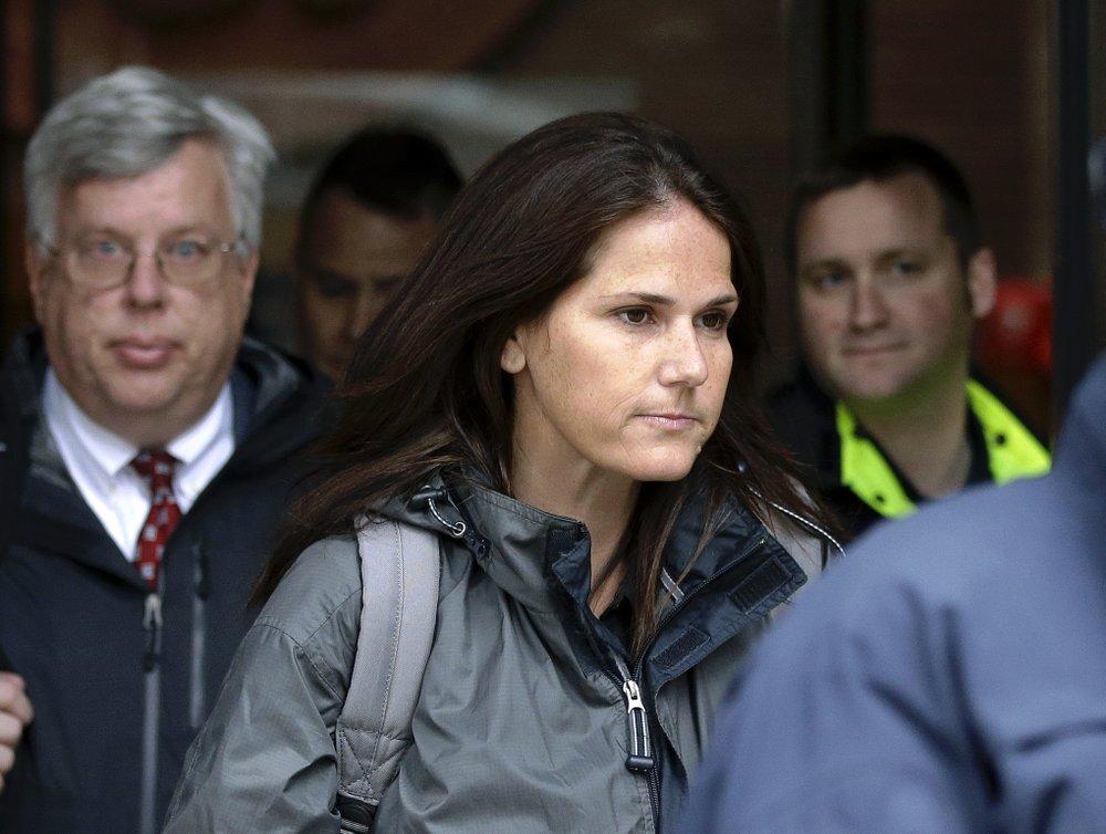 Former University of Southern California soccer coach Laura Janke departs federal court in Boston on Tuesday, May 14, 2019, where she pleaded guilty to charges in a nationwide college admissions bribery scandal. (AP Photo/Steven Senne)