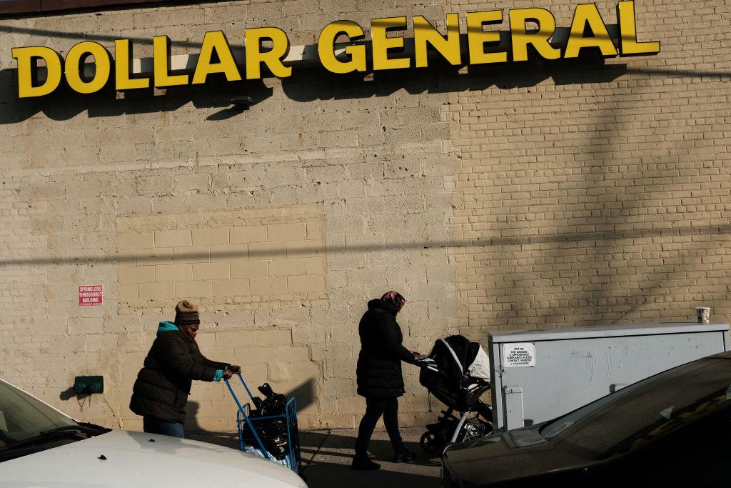 People walk by a Dollar General store in the Brooklyn borough of New York City on Dec. 11, 2018. (Spencer Platt/Getty Images)